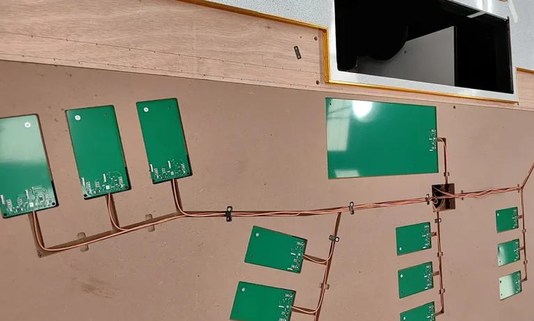 Casino gaming table embedded RFID reader board for real-time chip tracking