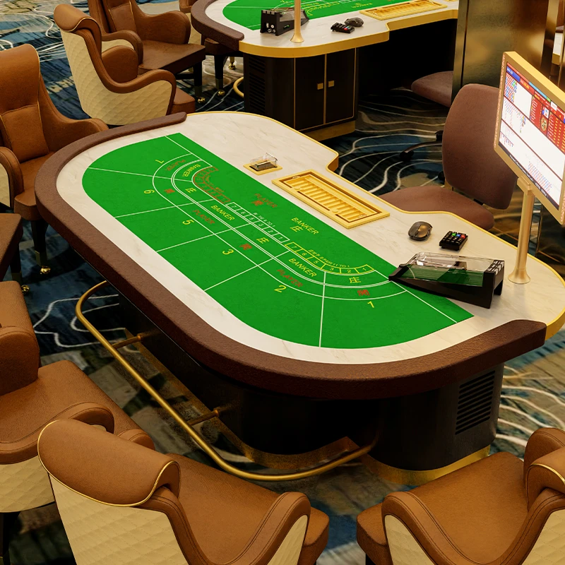 Custom baccarat gaming table with branded green felt installed in luxury VIP room