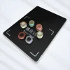 RFID cage chip reader with six stacks of colorful casino poker chips on the sensor surface RFID cage chip reader with six stacks of colorful casino poker chips on the sensor surface