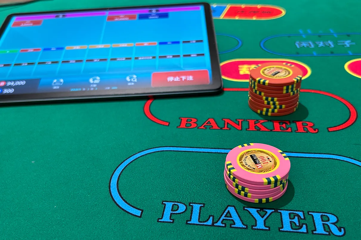 Casino gaming table with playing cards and chips